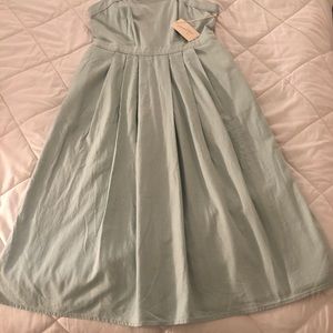 Brand new, never worn, apron style dress